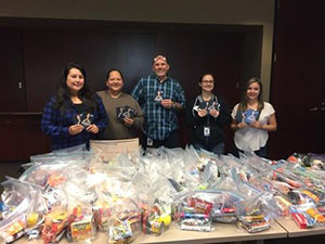 Employees donating food and supplies during Giving Tuesday.